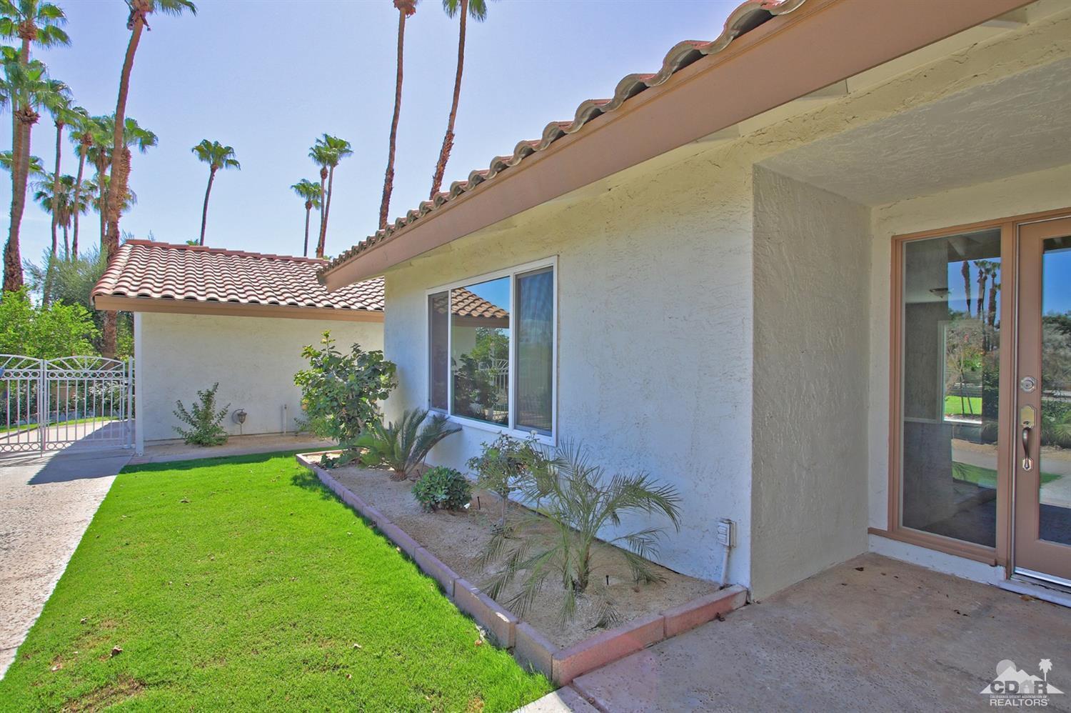 73733 Haystack Road Palm Desert, CA 92260 - Photo 5 of 36 a view of a house with a backyard