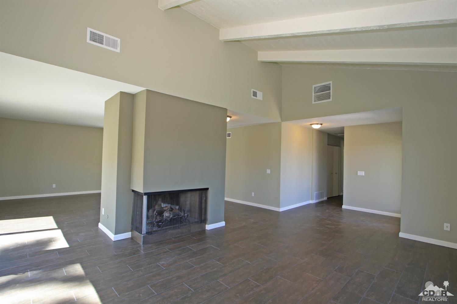 73733 Haystack Road Palm Desert, CA 92260 - Photo 8 of 36 a view of livingroom with table and chair