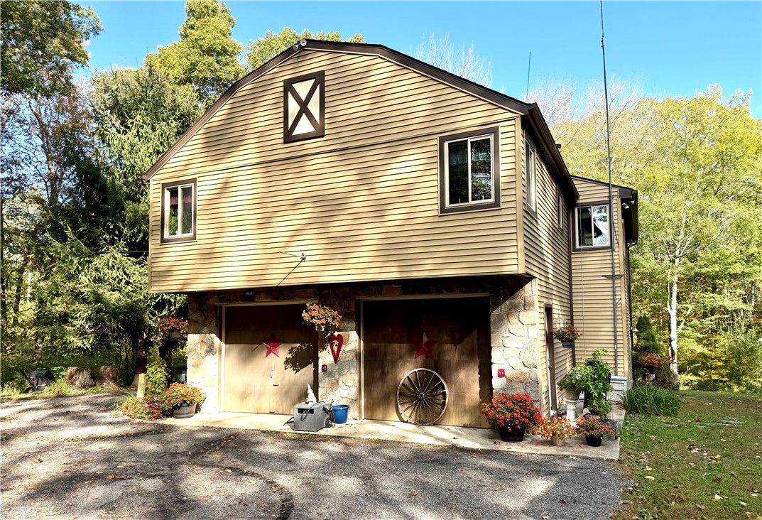 550 Twin Brook Lane Coventry, RI 02816 - Photo 5 of 41 Side of home with a 2 car garage