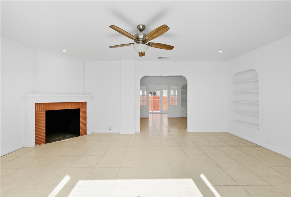 3841 Locust Street Riverside, CA 92501 - Photo 11 of 57 a view of empty room with a ceiling fan and window
