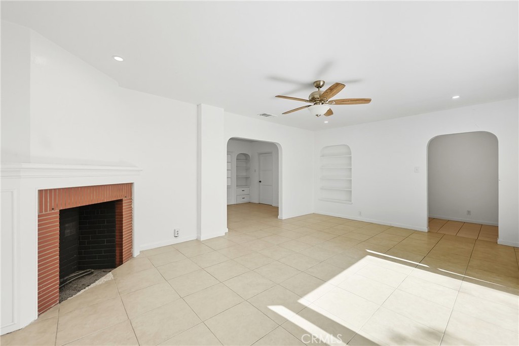 3841 Locust Street Riverside, CA 92501 - Photo 13 of 57 an empty room with fan and a ceiling fan