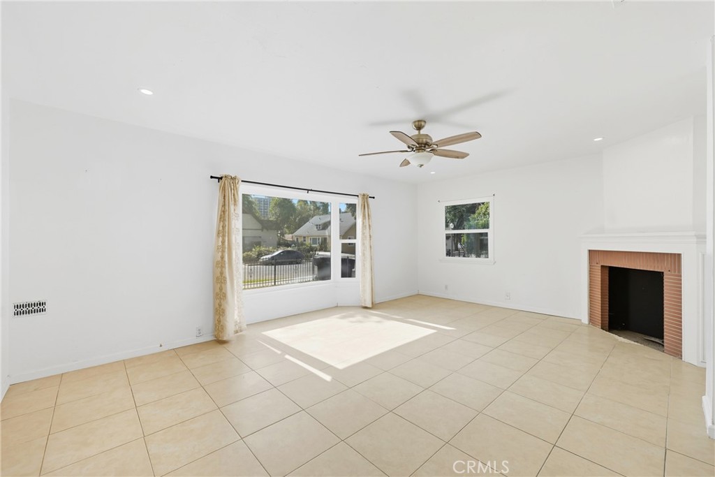 3841 Locust Street Riverside, CA 92501 - Photo 14 of 57 an empty room with fan and windows