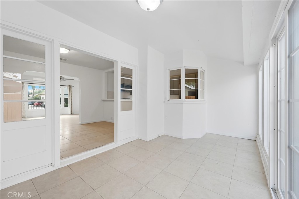 3841 Locust Street Riverside, CA 92501 - Photo 29 of 57 an empty room with windows and entrance