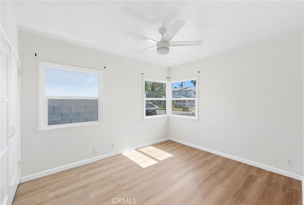 3841 Locust Street Riverside, CA 92501 - Photo 33 of 57 a view of empty room with wooden floor and fan
