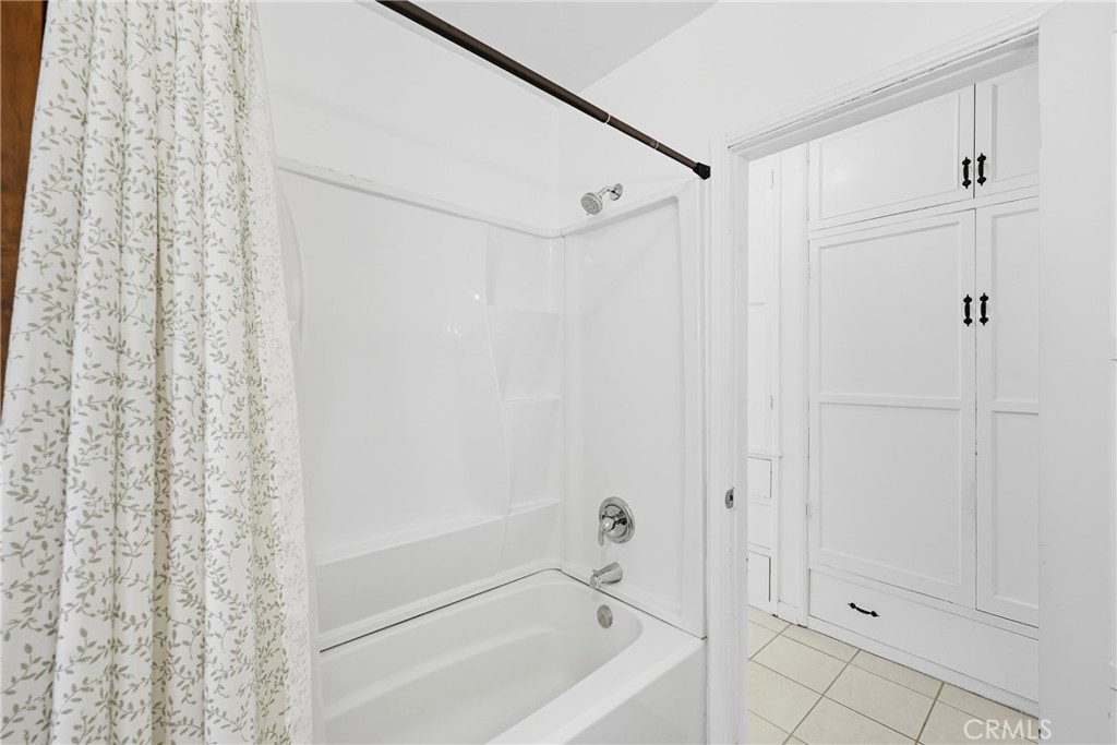 3841 Locust Street Riverside, CA 92501 - Photo 37 of 57 a bathroom with a shower and a tub