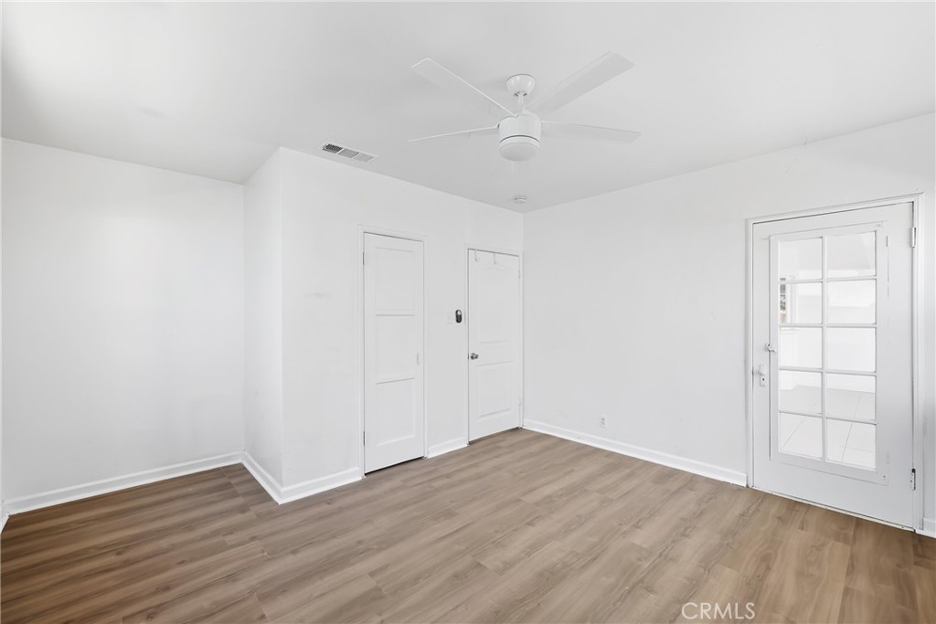 3841 Locust Street Riverside, CA 92501 - Photo 39 of 57 wooden floor in an empty room with a window