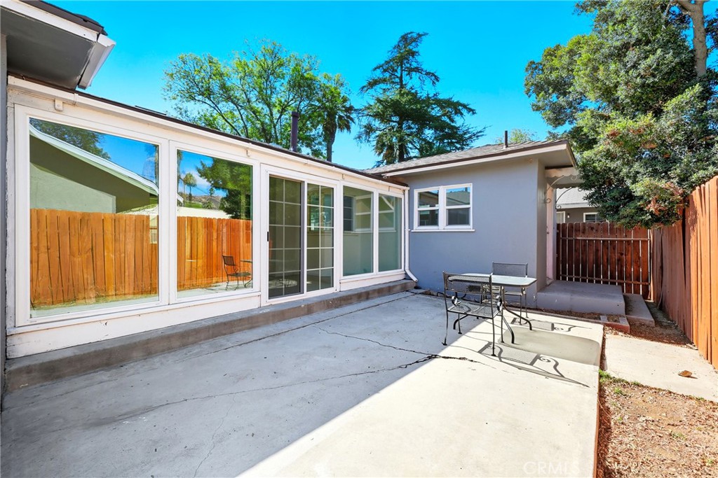 3841 Locust Street Riverside, CA 92501 - Photo 45 of 57 a backyard of a house with table and chairs