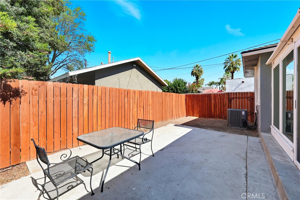 3841 Locust Street Riverside, CA 92501 - Photo 46 of 57 a backyard of a house with table and chairs