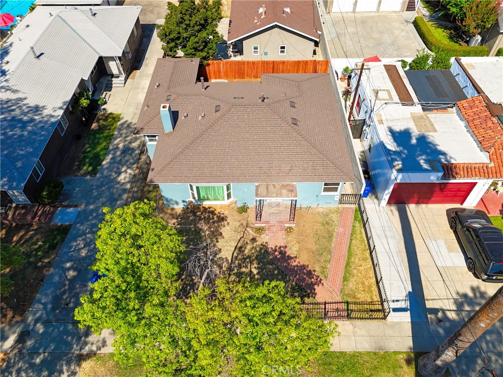 3841 Locust Street Riverside, CA 92501 - Photo 49 of 57 an aerial view of a house with a yard and trees