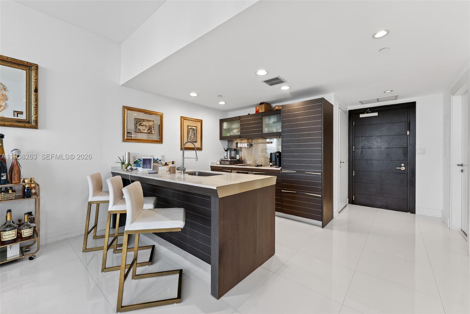 200 Biscayne Blvd Way, Unit 4414 Miami, FL 33131 - Photo 4 of 29 a living room with stainless steel appliances kitchen island granite countertop furniture and a view of kitchen
