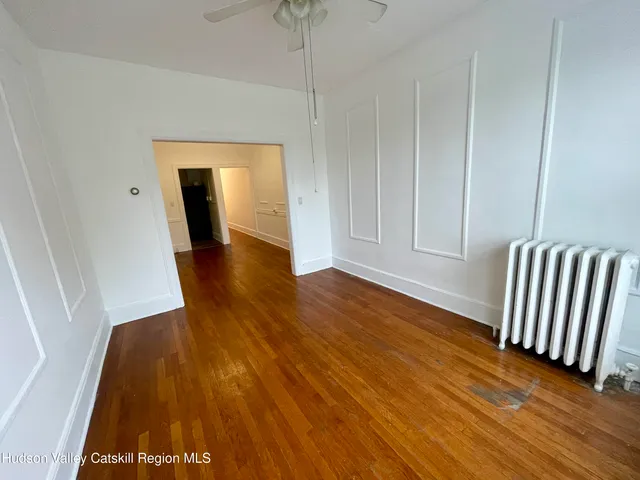 a view of front door with wooden floor