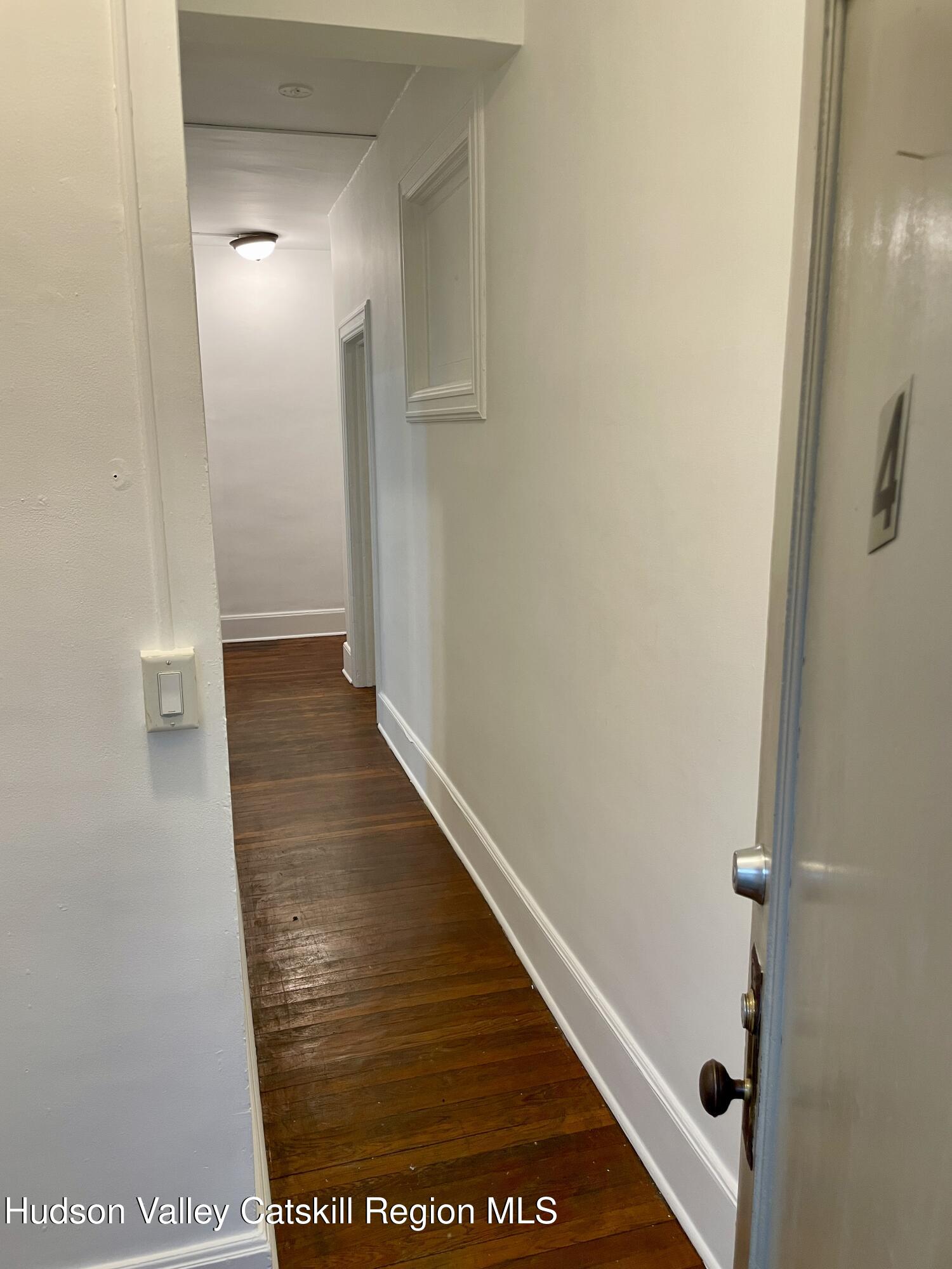 711 Warren Street, Unit 4 Hudson, NY 12534 - Photo 2 of 14 a view of a hallway
