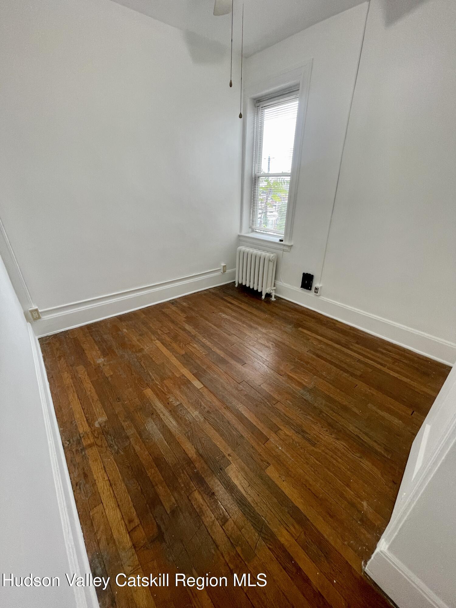 711 Warren Street, Unit 4 Hudson, NY 12534 - Photo 6 of 14 a view of an empty room and window