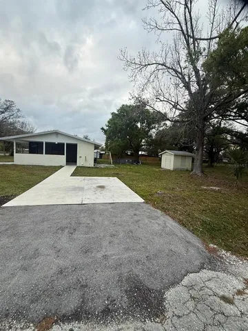 a view of swimming pool with a yard