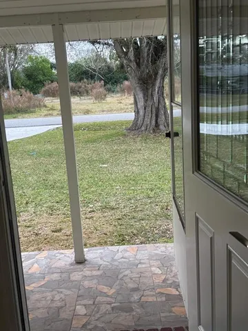 a view of a glass door and porch