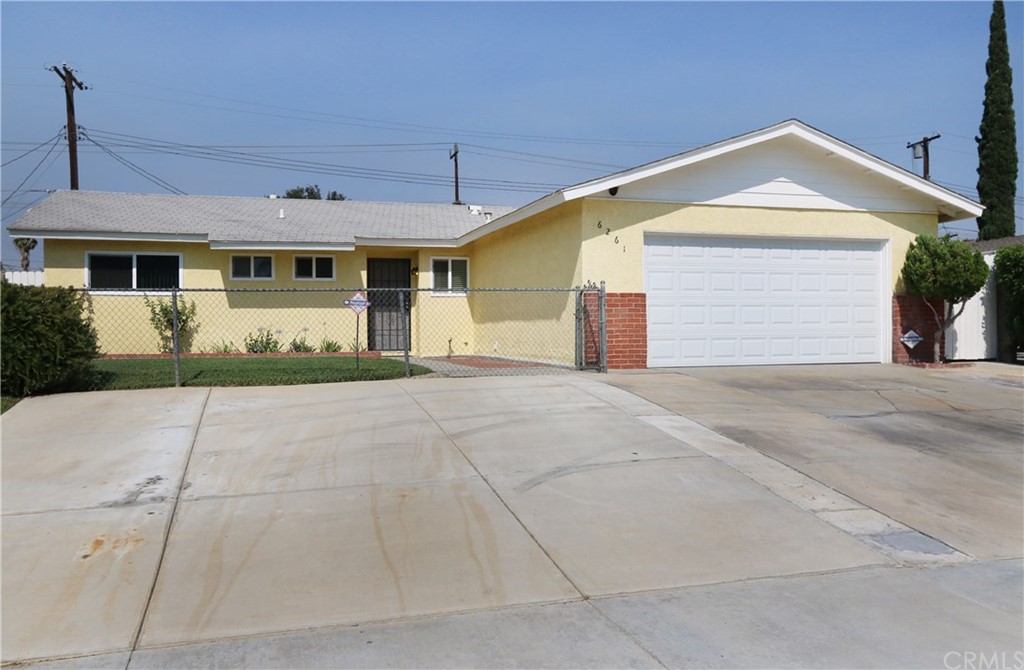 6261 Antioch Avenue Riverside, CA 92504 - Photo 1 of 1 a front view of a house with a yard and garage