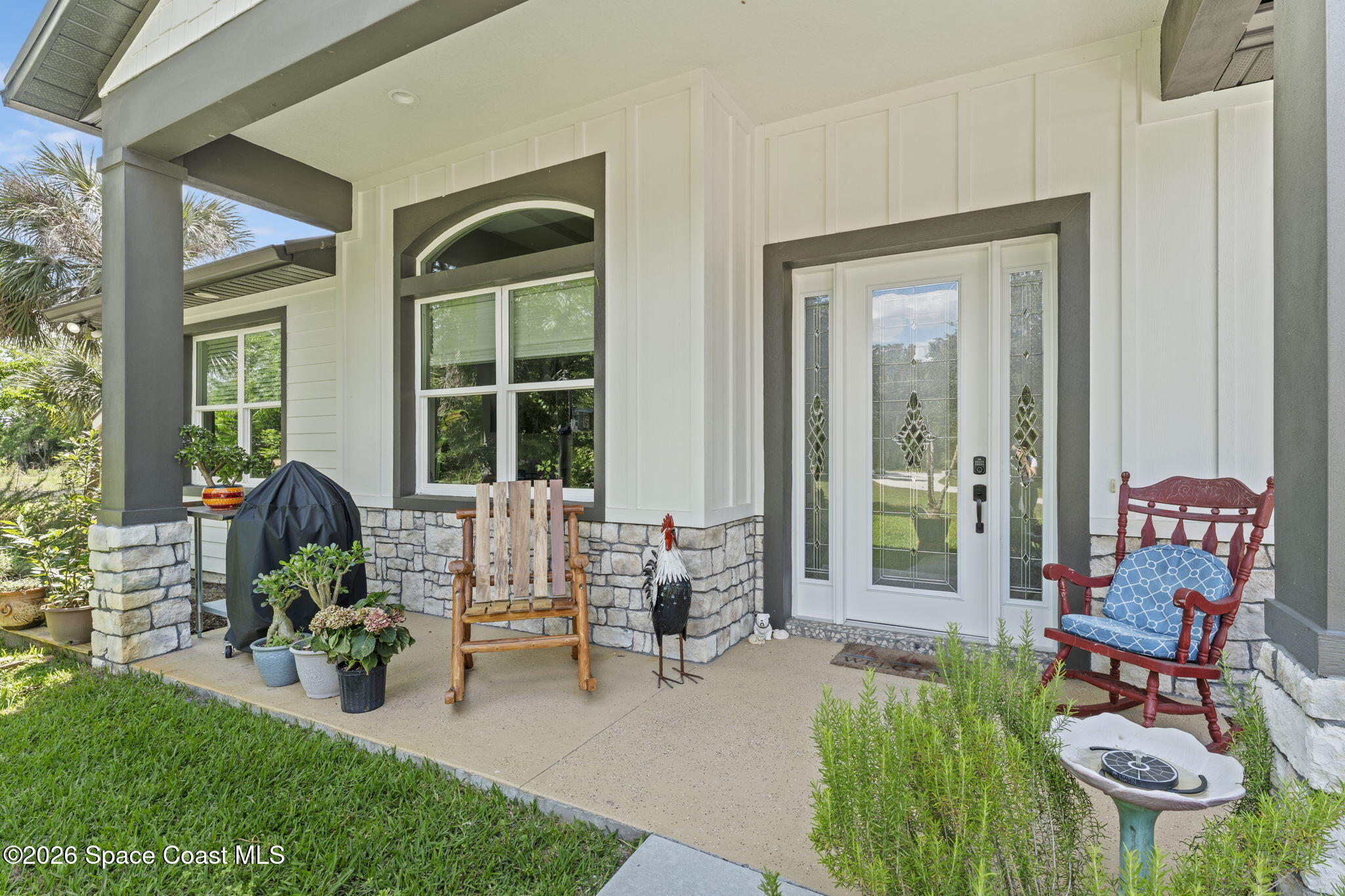1740 Ford Road Mims, FL 32754 - Photo 3 of 43 a balcony with chairs and a potted plant