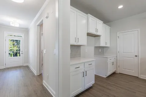 a kitchen with stainless steel appliances a stove a sink and a microwave