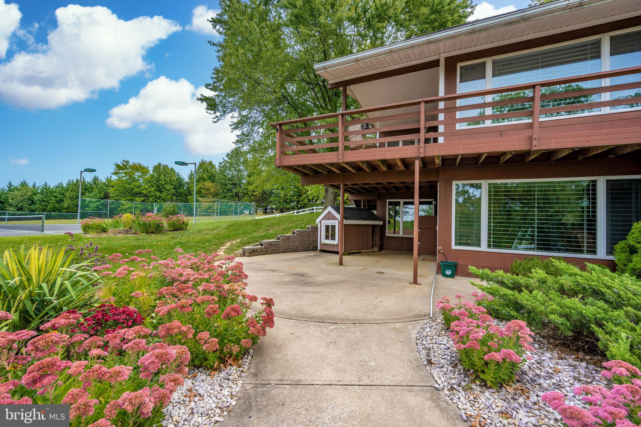 23036 Foxville Road Smithsburg, MD 21783 - Photo 57 of 135 side patio and deck view towards tennis court