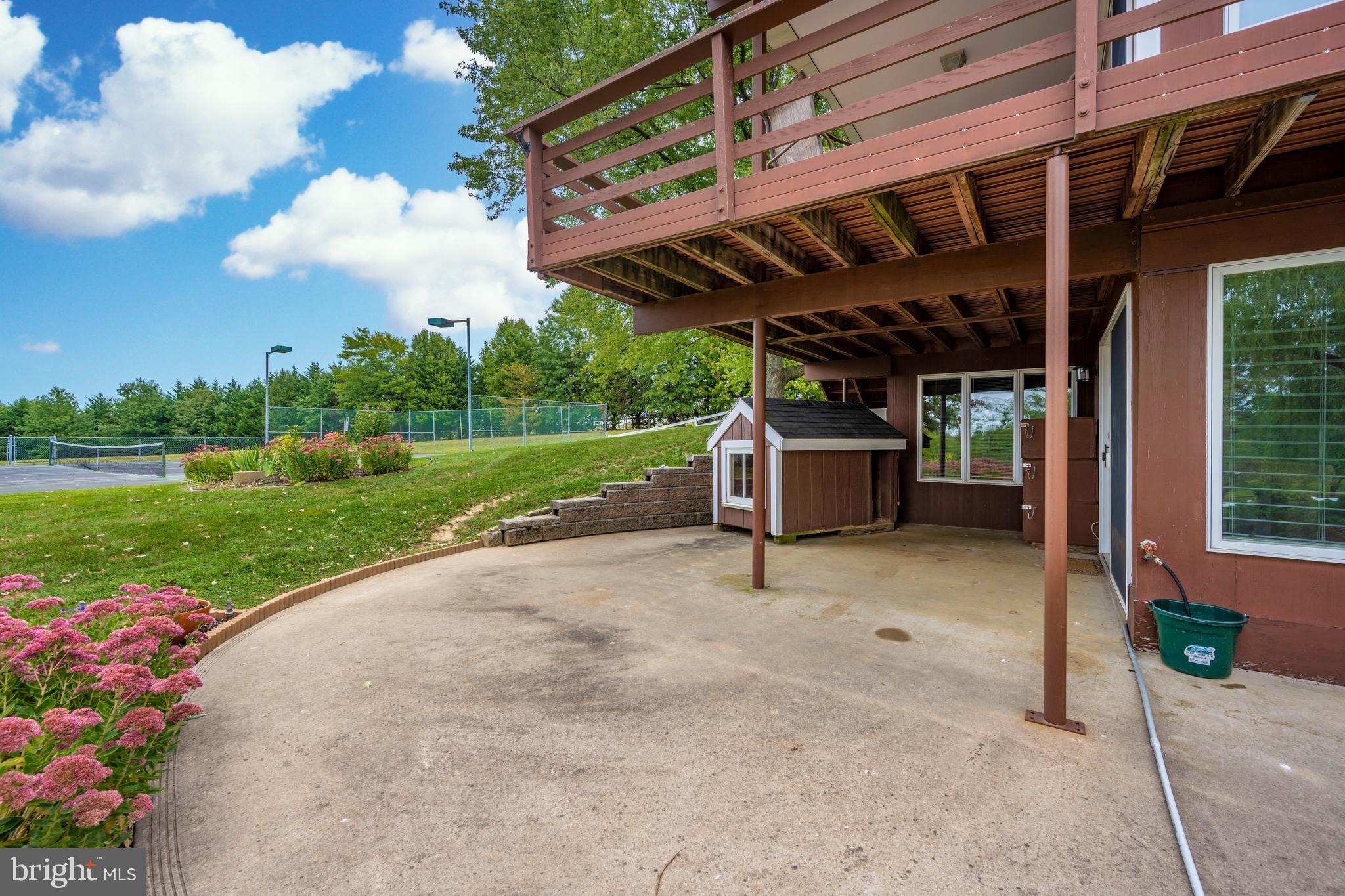 23036 Foxville Road Smithsburg, MD 21783 - Photo 58 of 135 side patio and deck view towards tennis court