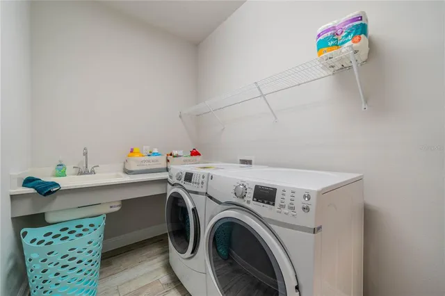 a utility room with dryer and washer