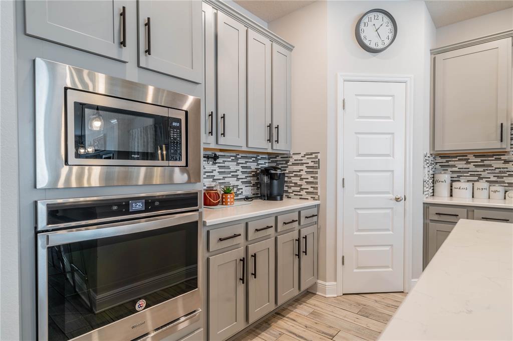 5538 Spanish Moss Cove Bradenton, FL 34203 - Photo 14 of 31 a kitchen with granite countertop a stove and a microwave
