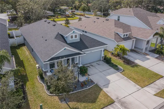 an aerial view of a house with a swimming pool