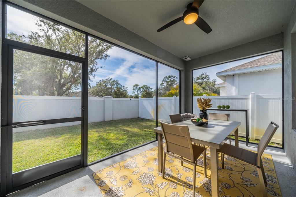 5538 Spanish Moss Cove Bradenton, FL 34203 - Photo 6 of 31 a dining room with furniture water view and a floor to ceiling window
