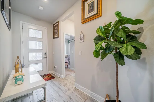 a bathroom with a sink a mirror and a shower curtain