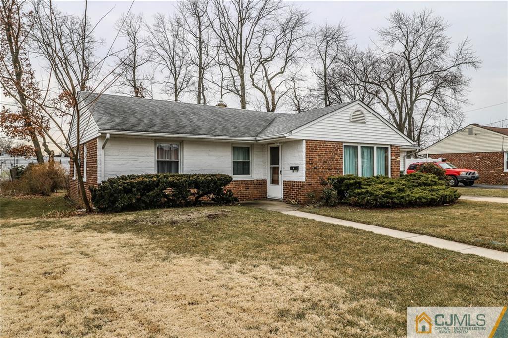 38 Gurley Road Edison, NJ 08817 - Photo 2 of 25 a front view of a house with a garden and trees