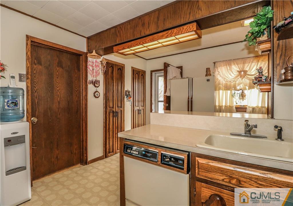 38 Gurley Road Edison, NJ 08817 - Photo 13 of 25 a view of a kitchen from a hallway