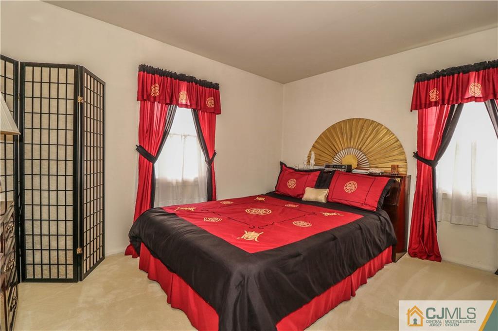 38 Gurley Road Edison, NJ 08817 - Photo 15 of 25 a bedroom with a bed and a window