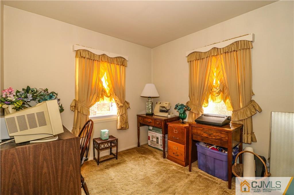 38 Gurley Road Edison, NJ 08817 - Photo 17 of 25 a view of a workspace with furniture and a window
