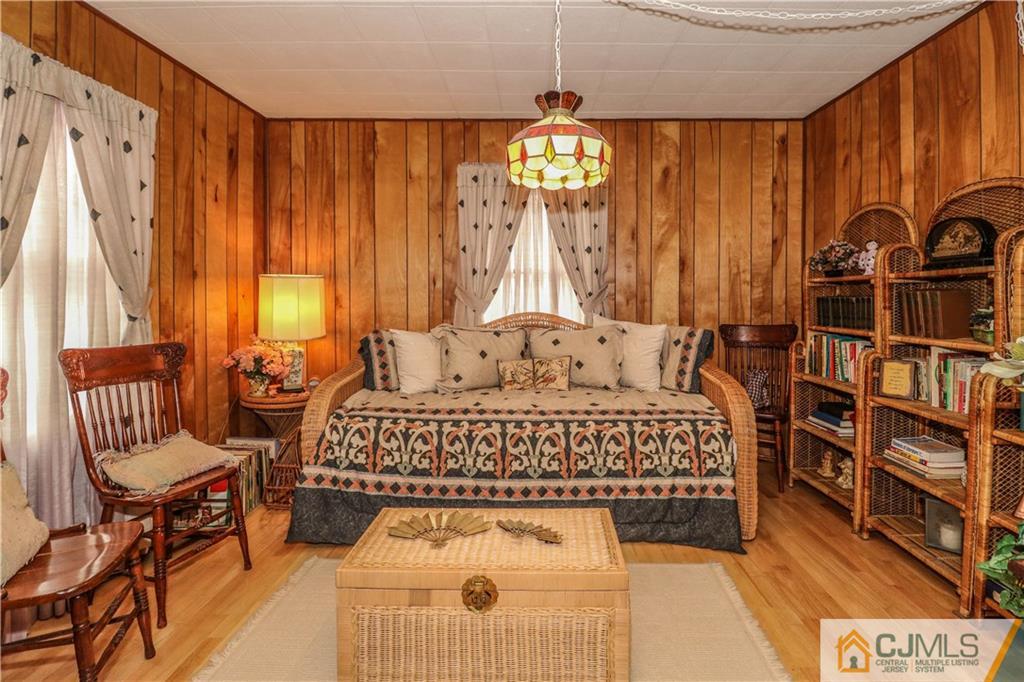 38 Gurley Road Edison, NJ 08817 - Photo 18 of 25 a spacious bedroom with a bed and a chandelier