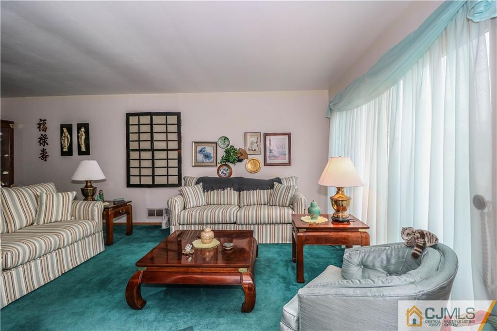 38 Gurley Road Edison, NJ 08817 - Photo 5 of 25 a living room with furniture and a large window