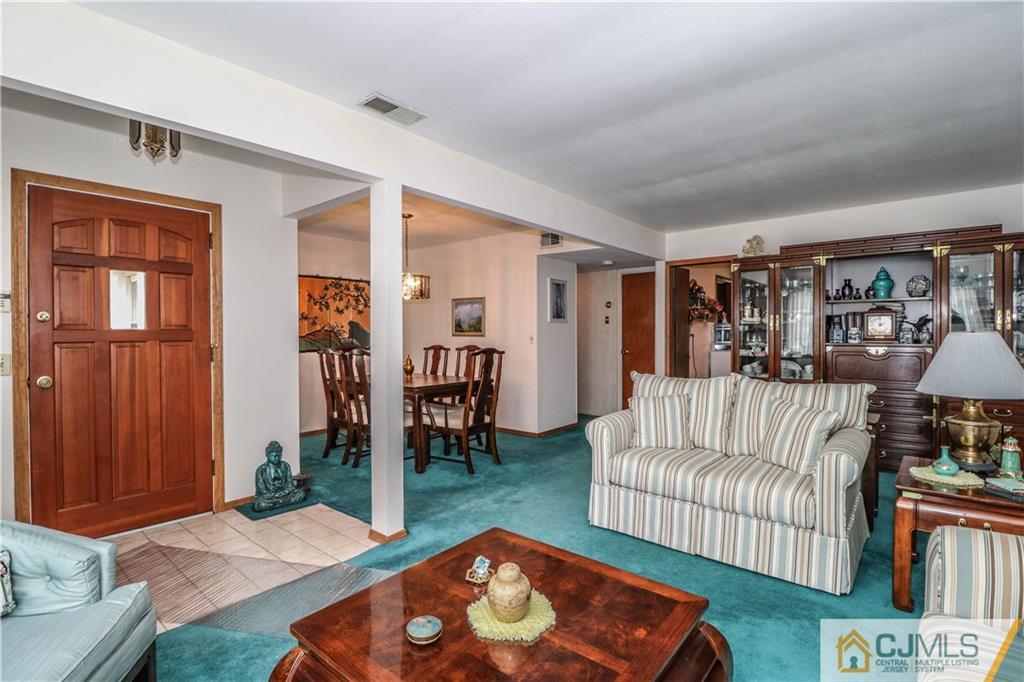 38 Gurley Road Edison, NJ 08817 - Photo 7 of 25 a living room with furniture and a rug