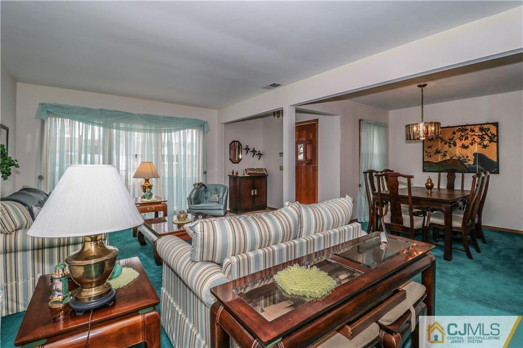 38 Gurley Road Edison, NJ 08817 - Photo 8 of 25 a living room with furniture and a wooden floor