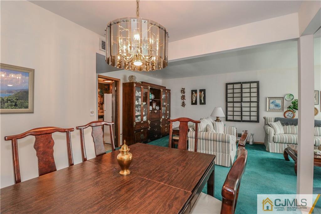 38 Gurley Road Edison, NJ 08817 - Photo 10 of 25 a view of a dining room with furniture and wooden floor