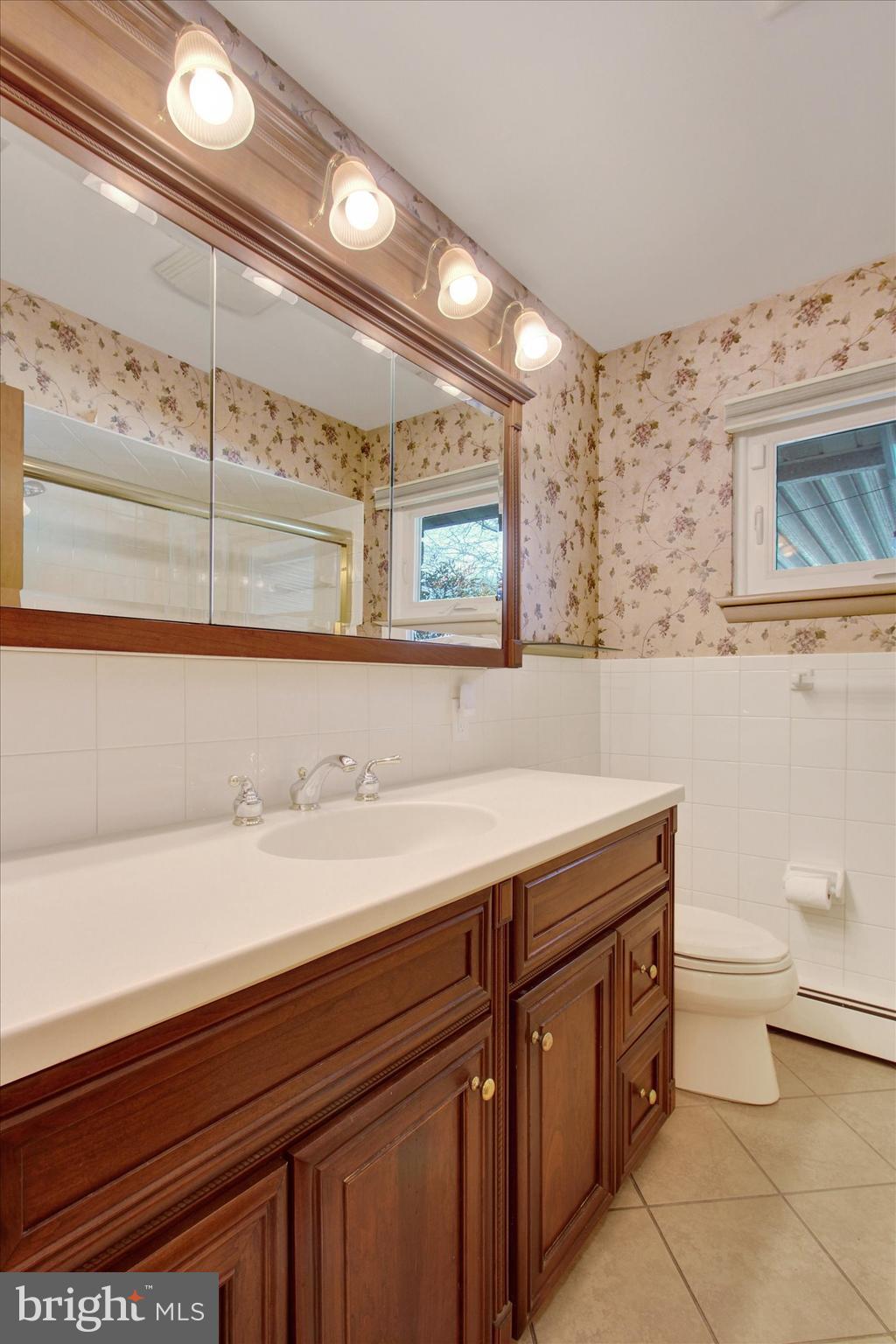 200 Sunset Avenue Hanover, PA 17331 - Photo 16 of 28 a bathroom with a sink a toilet and mirror