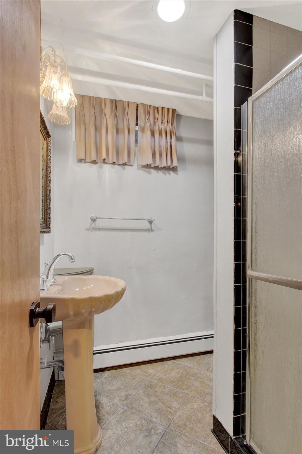 200 Sunset Avenue Hanover, PA 17331 - Photo 21 of 28 a bathroom with a sink and a mirror
