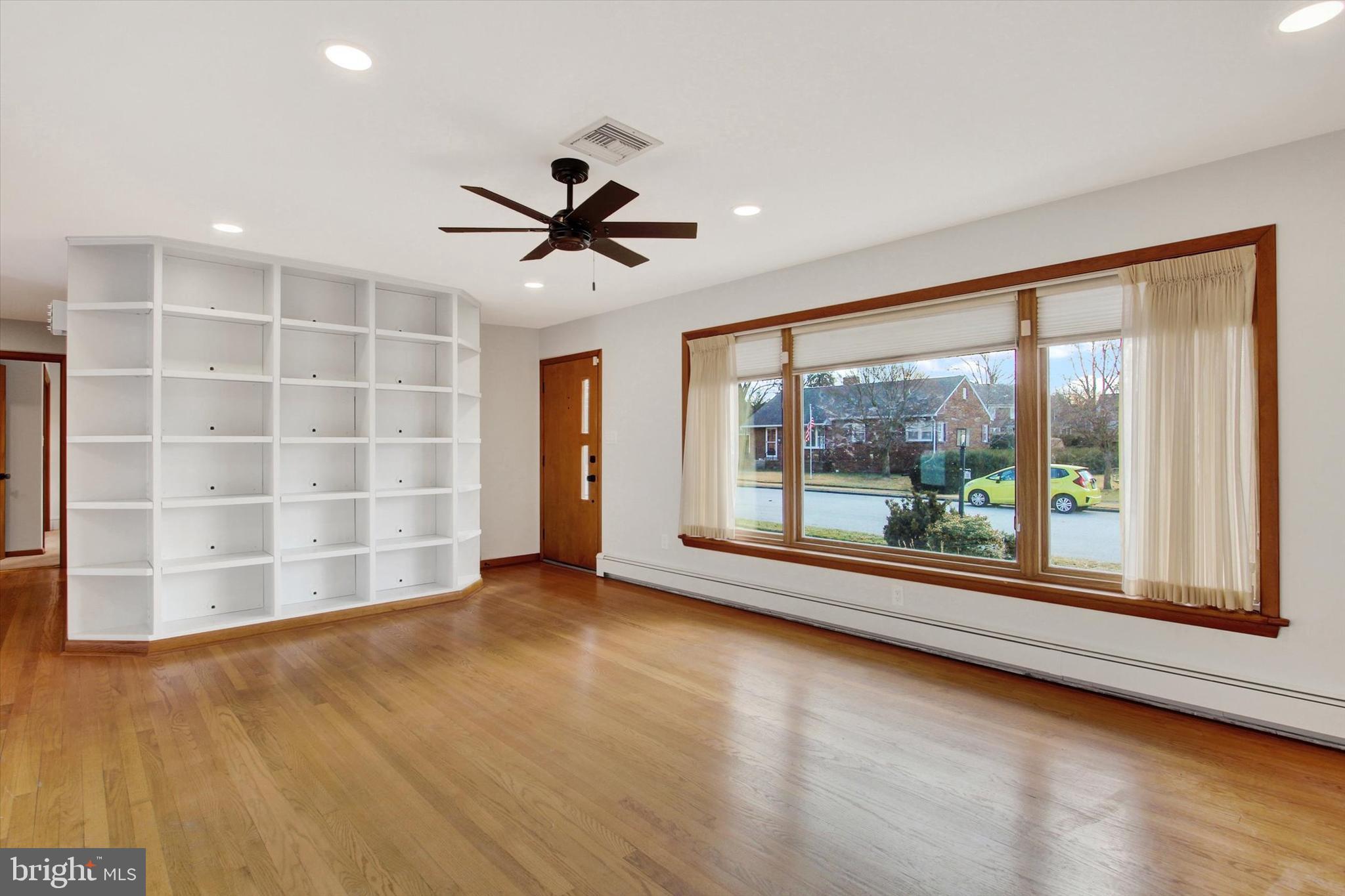 200 Sunset Avenue Hanover, PA 17331 - Photo 4 of 28 a view of an empty room with a window and wooden floor
