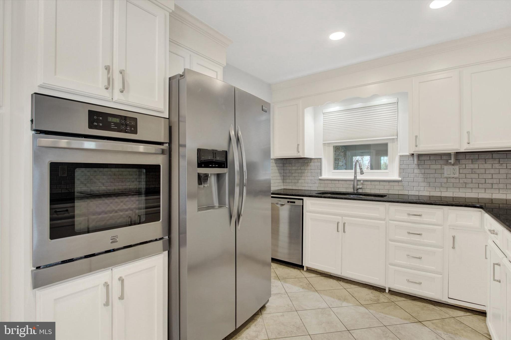 200 Sunset Avenue Hanover, PA 17331 - Photo 10 of 28 a kitchen with granite countertop white cabinets and stainless steel appliances