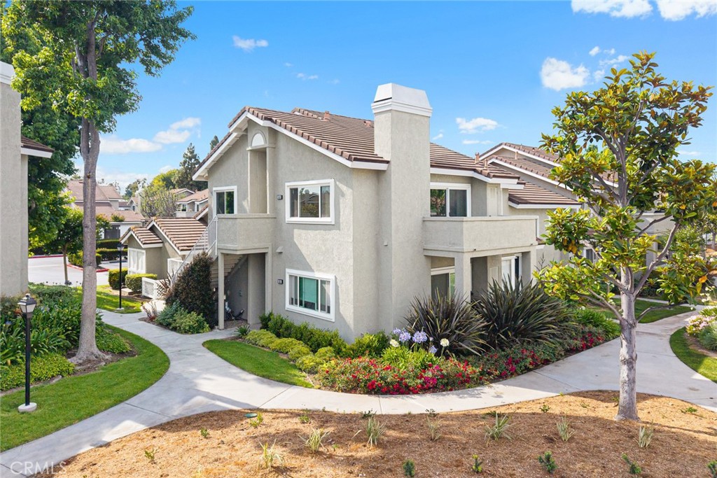 549 Springbrook North Irvine, CA 92614 - Photo 1 of 1 a front view of a house with a yard