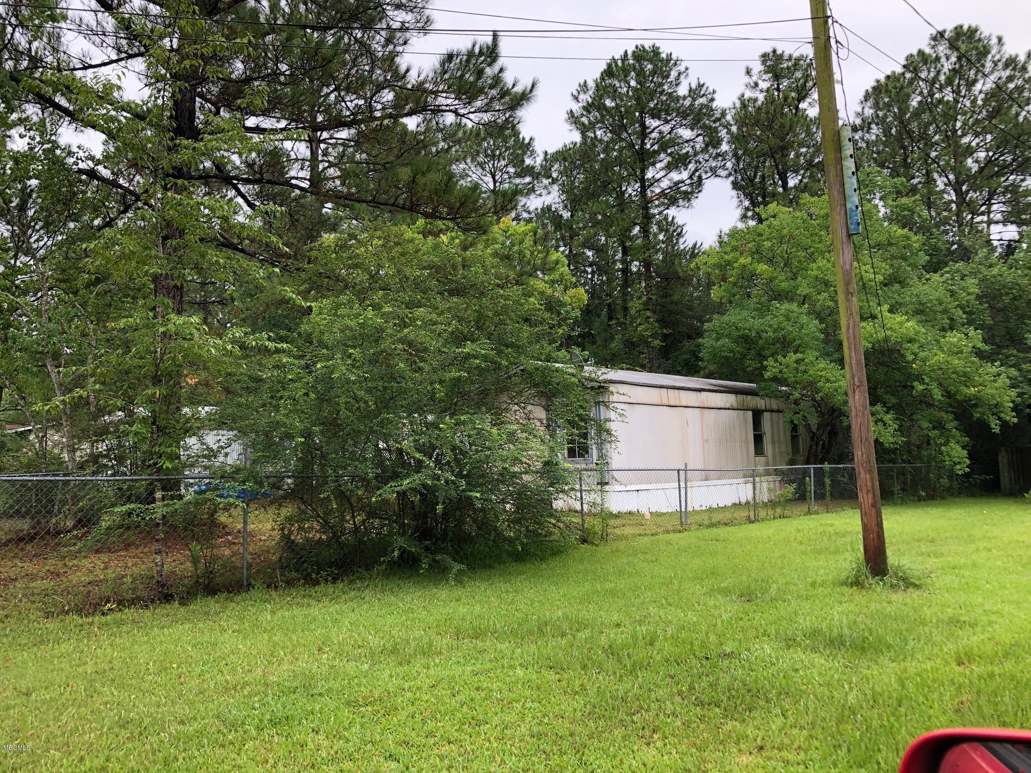 2225 Laurelglen Road Gautier, MS 39553 - Photo 2 of 5 2225 Laurel Glen Rear View 7-27-2020