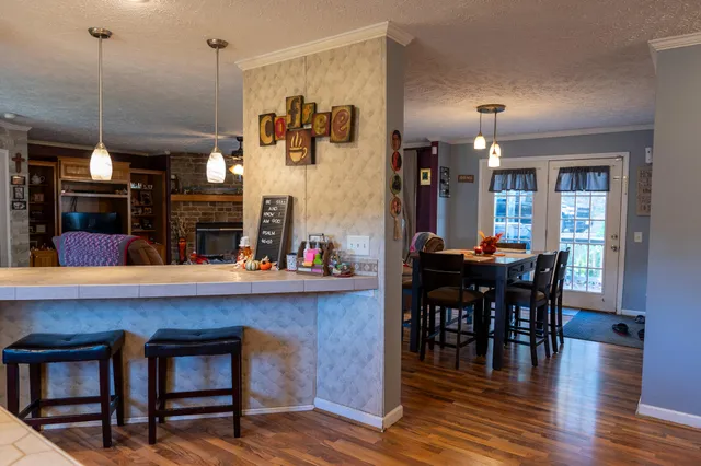 a view of a dining area with furniture and wooden floor