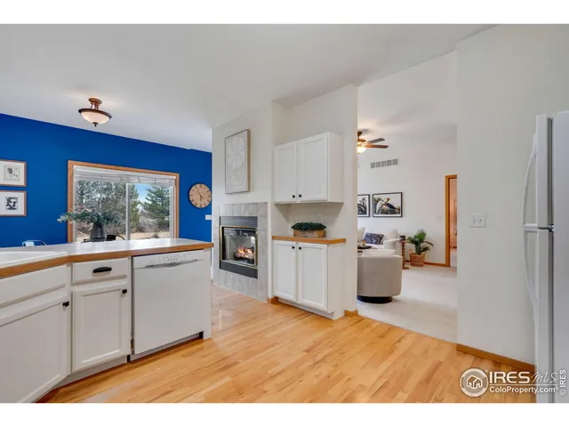 a open kitchen with cabinets a sink and appliances