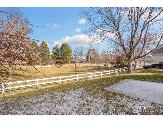 a view of a yard with swimming pool