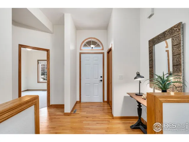a view of living room with furniture and wooden floor