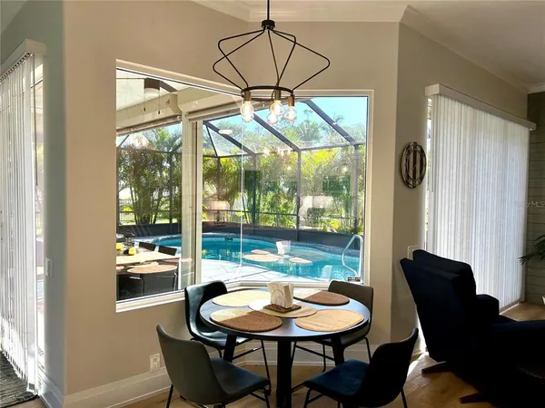 a dining room with furniture and window