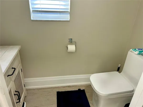 a bathroom with a toilet and a bathtub